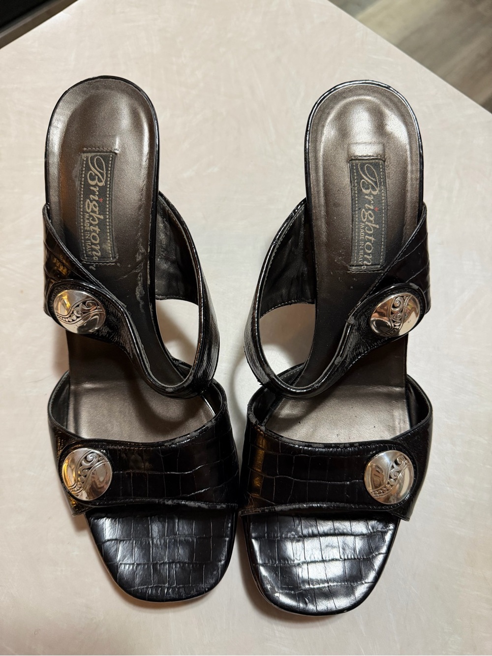 Brighton Black Croc-Embossed Slide Heels with Silver Medallions